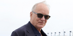 Stellan Skarsgard was seen wearing grey Zegna EZ0229/S 20J sunglasses with brown lenses at the Zegna Summer 2027 show in Los Angeles, June 2026.