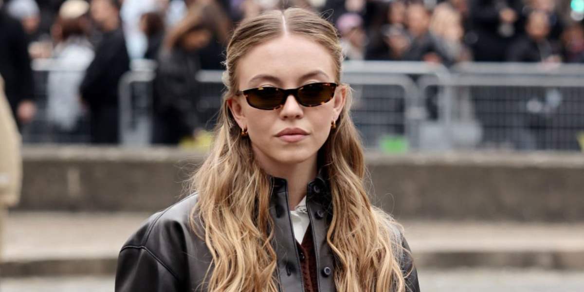 Actress Sydney Sweeney was seen wearing tortoiseshell Miu Miu MU A06S 14L09Z sunglasses with brown lenses at the Miu Miu Fall/Winter 2025 fashion show during Paris Fashion Week. Shop online now on Pretavoir