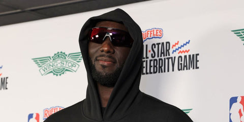 Senehalese basketball player Tacko Fall was seen wearing black Oakley Meta Vanguard OW8001 01 Prizm Smart Glasses at the 2026 NBA All-Star Celebrity Game in Inglewood, California, February 2026