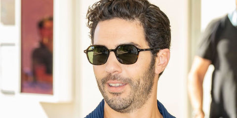French-Algerian actor Tahar Rahim was seen wearing dark tortoiseshell Ray-Ban John RB 2194 902/31 sunglasses with green lenses to the Jury Dinner during the 74th Cannes Film Festival