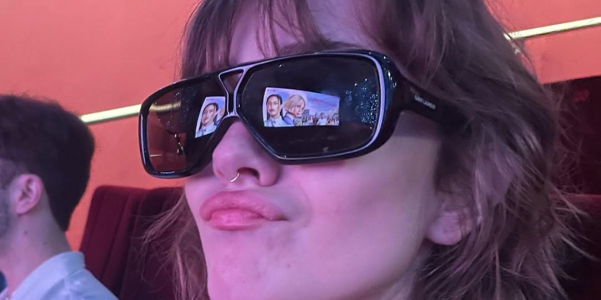 Talia Ryder was seen wearing black Saint Laurent Sun SL 569 Y 001 sunglasses at the premiere of 2022 Netflix movie "DO Revenge"