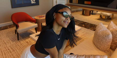 Track and field athlete Tara Davis-Woodhall was seen wearing black Prada PR 26ZS 16K08Z cat eye sunglasses in her Instagram post, October 2023.