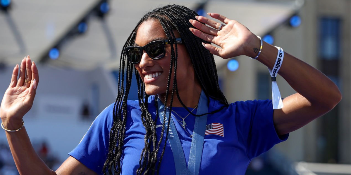 Track and field athlete Tara Davis-Woodhall was seen wearing black Ray-Ban Wayfarer Reverse RB R0502S 6677/VR sunglasses during Paris Olympics 2024.