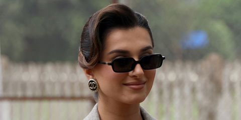 Bollywood actress Tara Sutaria was seen wearing black Miu Miu Regard MU 11ZS 16K5S0 rectangular sunglasses in Mumbai, August 2026.