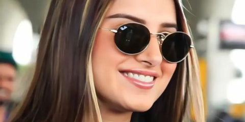 Bollywood actress Tara Sutaria was seen wearing gold Ray-Ban Oval RB 3547 001/31 sunglasses