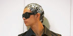 South Korean rapper Tarzzan of AllDay Project was seen wearing black Gucci GG2175SA 001 Asian Fit shield sunglasses in his Instagram post, January 2026.