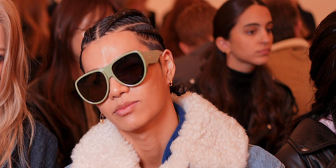 South Korean rapper Tarzzan of AllDay Project was seen wearing light green Loewe Signature LW40170U 96E sunglasses at the Loewe Spring/Summer 2026 fashion show during Paris Fashion Week.