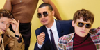 British-Thai actor Tayme Thapthimthong, pictured in the middle alongside The White Lotus casts Patrick Schwarzenegger and Sam Nivola, was seen wearing silver Miu Miu MU A55S 1BC80Q sunglasses in The Wrap Book vol. 4 feature, August 2025. Shop oline now on Pretavoir