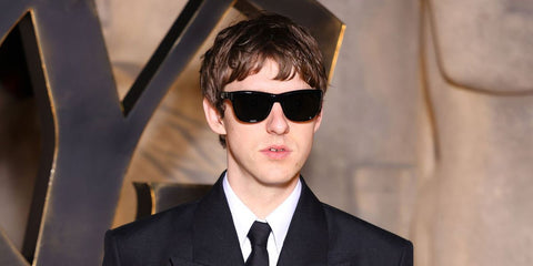Musician and DJ Harrison Patrick Smith, widely known as The Dare, was seen wearing black Saint Laurent Sun SL 816 001 sunglasses at the Saint Laurent Fall/Winter 2026 fashion show during Paris Fashion Week.