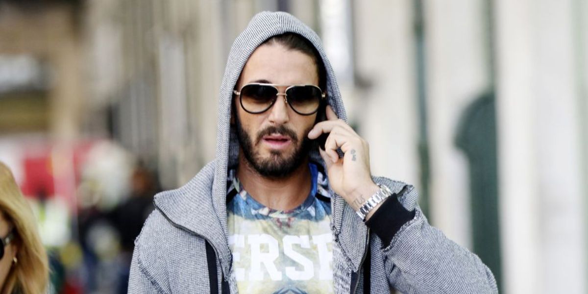 French television personality Thomas Vergara was seen wearing black and gold Dita Mach Two DRX 2031B 60 sunglasses with brown gradient lenses