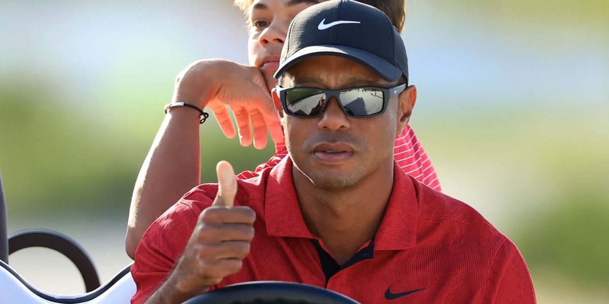 Tiger Woods is seen wearing Nike Brazen Boost FJ1975 010 sunglasses in a 2022 championship