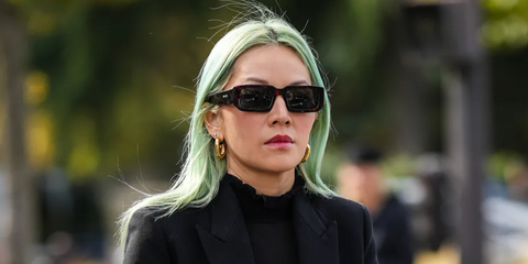 Tina Leung was seen wearing tortoise Prada PR 06YS 2AU8C1 rectangular sunglasses during Paris Fashion Week.
