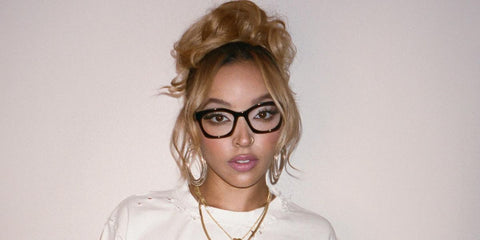 Tinashe is seen wearing Prada PR A05V 16K1O1 optical glasses in her Facebook post