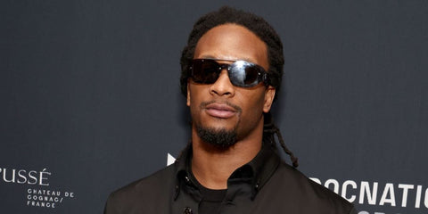 American football player Todd Gurley was seen wearing transparent grey Versace 2235 1001/6G sunglasses at the Roc Nation Super Bowl Party in Las Vegas, February 2024.