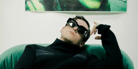 Tom Daley wears Loewe x Paula's Ibiza LW40033I 01A sunglasses in an editorial page of L'Officiel Hommes Italia