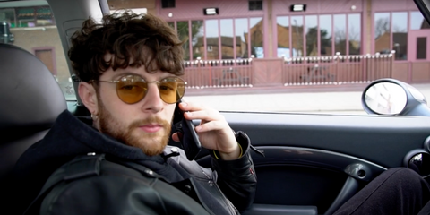 Tom Grennan is seen wearing Ray-Ban Round Metal RB 3447 9228/33 sunglasses on his YouTube channel