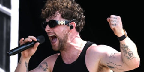 Tom Grennan is seen wearing Versace 4361 GB1/87 Medusa Biggie Sunglasses at the 2023 Glastonbury Festival