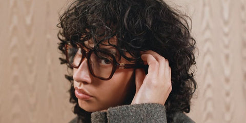Singer-songwriter Towa Bird was seen wearing striped brown Miu Miu MU 03YV 26E1O1 optical glasses in the Miu Miu Eyewear Fall/Winter 2025 campaign.