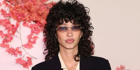 Singer-songwriter Towa Bird was seen wearing Miu Miu MU A54S 5AK04O rimless oval sunglasses with grey gradient lenses at the season 2 premiere of Netflix's "Nobody Wants This" in Los Angeles, October 2025.