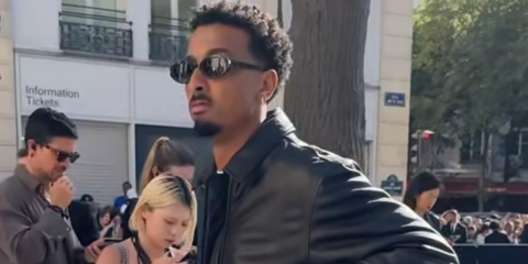 Musician and actor Travis Bennett was seen wearing black Saint Laurent Sun SL 567 001 sunglasses at the Saint Laurent Menswear Spring/Summer 2026 fashion show during Paris Men's Fashion Week.