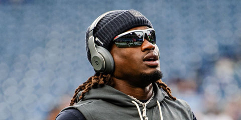 American football player Tremon Smith of the Houston Texans was seen wearing grey silver Prada Linea Rossa SPS A02 14Z05A sunglasses ahead of a game against the Seattle Seahawks, October 2025.