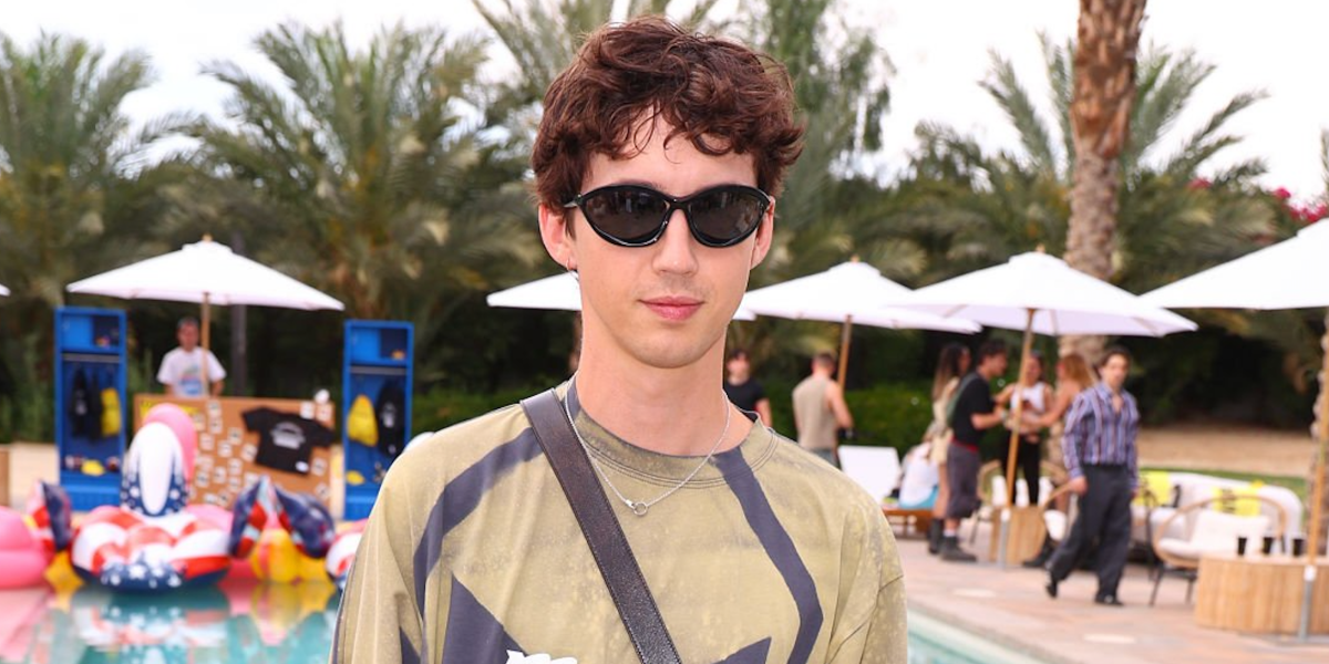 Troye Sivan was seen wearing black Prada PR A23S 1AB5S0 sunglasses at the 2025 Coachella music festival