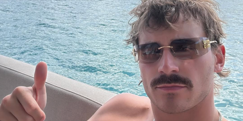 American country singer Tucker Wetmore was seen wearing gold Miu Miu MU A51S 5AK20P rimless sunglasses with brown gradient lenses in his Instagram post, December 2025.