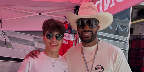 Tyson Beckford, pictured on the right, was seen wearing black and gold Carrera Flaglab 17 2M286 Special Edition sunglasses at COTA Circuit of the Americas, March 2025