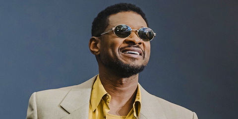 Usher was seen wearing gold Saint Laurent Sun SL 692 003 oval sunglasses with green lenses at the Watches and Wonders event in Geneva, April 2026.