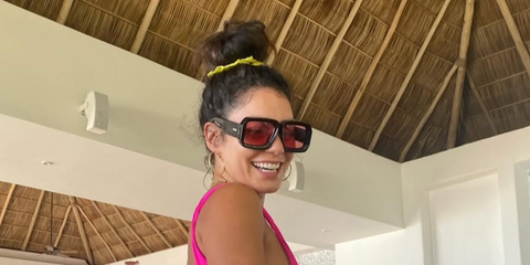 Vanessa Hudgens was seen wearing black Loewe x Paula's Ibiza LW40064U 01Y sunglasses with red lenses in her Instagram post, December 2025.