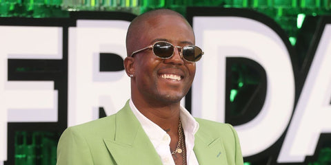 Television personality Vas J. Morgan was seen wearing gold Prada PR B53S 5AK09Z sunglasses at the UK premiere of "Freakier Friday" in London, July 2025.