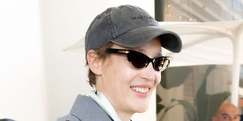 Vicky Krieps was seen wearing black and gold Bottega Veneta BV1431S 001 cat-eye sunglasses at Hotel Martinez, during Cannes Film Festival 2026.