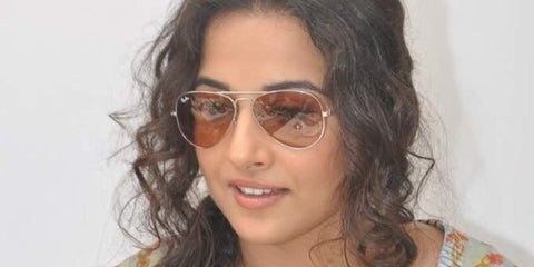 Bollywood actress Vidya Balan was seen wearing Ray-Ban Aviator 3025 001/33 sunglasses with brown lenses. Shop online now on Pretavoir