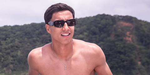 Brazilian footballer Vitor Reis of Girona FC and Manchester City FC was seen wearing black Prada PR 17WS 1AB5S0 Symbole Sunglasses in his Instagram post, December 2024.