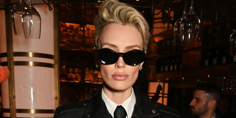 Model and actress Wallis Day was seen wearing black Versace 4466U GB1/87 sunglasses  at the Perfect Magazine London Fashion Week Party in February 2025.