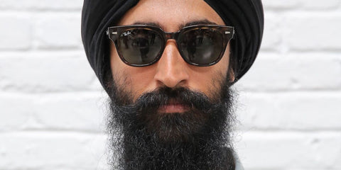 Indian-American actor and designer Waris Ahluwalia was seen wearing black Ray-Ban Meteor RB 2168 901/31 sunglasses with a slight of striped pattern. Shop online now on Pretavoir