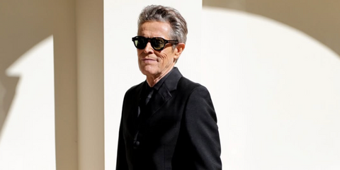 Willem Dafoe is seen wearing Prada PR A16S 17N20G Polarised sunglasses to the 2024 Cannes Film Festival