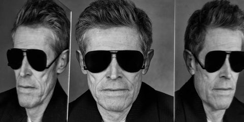 Willem Dafoe is seen wearing Saint Laurent Sun SL 690 Dust 001 sunglasses in an interview with The Guardian