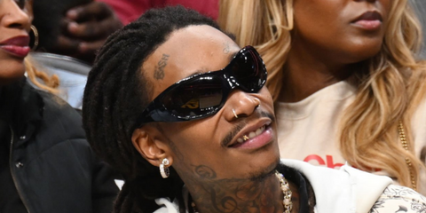 Rapper Wiz Khalifa at the new Orleans Pelicans Vs. Atlanta Hawks game on March 10th 2024 wearing Balenciaga Skin Cat sunglasses