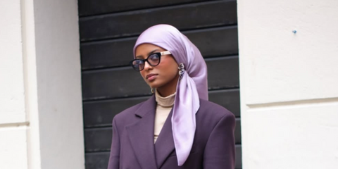 Wolfie Aziza was seen wearing two-tone black and white Gucci GG0959S 001 Blue & Beyond sunglasses with photochromic lenses to attend the Gucci Spring/Summer 2025 fashion show during Milan Fashion Week