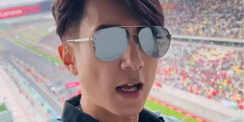 Bruneian actor and singer Wu Chun was seen wearing gold Hugo Boss 1537/F/SK J5GT4 aviator sunglasses with silver mirrored lenses at the F1 Grand Prix of Shanghai, China 2024.