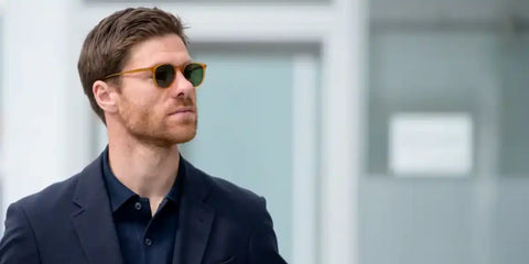 Xabi Alonso was seen wearing butterscotch brown yellow Garrett Leight Kinney 2007 BT-PGN sunglasses with green lenses