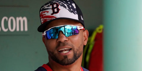 Aruban baseball player Xander Bogaerts was seen wearing an older version of white Oakley Radar EV Path OO9208 sunglasses (with red temples)