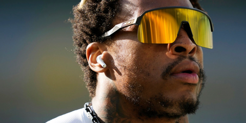 American football player Xavier McKinney of the Green Bay Packers was seen wearing black Oakley Sutro Lite OO9463 13 Prizm sunglasses prior to a game against the Houston Texans in October 2024.