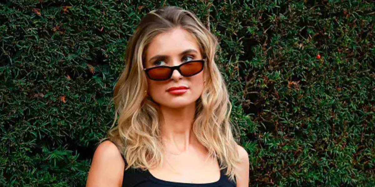 Xenia Adonts was seen wearing black Miu Miu MU A06S 16K10I sunglasses with brown lenses at the Burberry Spring/Summer 2026 fashion show during London Fashion Week. Shop online now on Pretavoir
