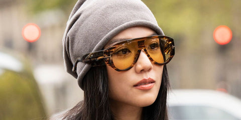 Singaporean fashion and creative force Yoyo Cao was seen wearing striped brown Tom Ford Bronson TF1044 56E sunglasses with yellow lenses during Paris Fashion Week season Spring/Summer 2026.