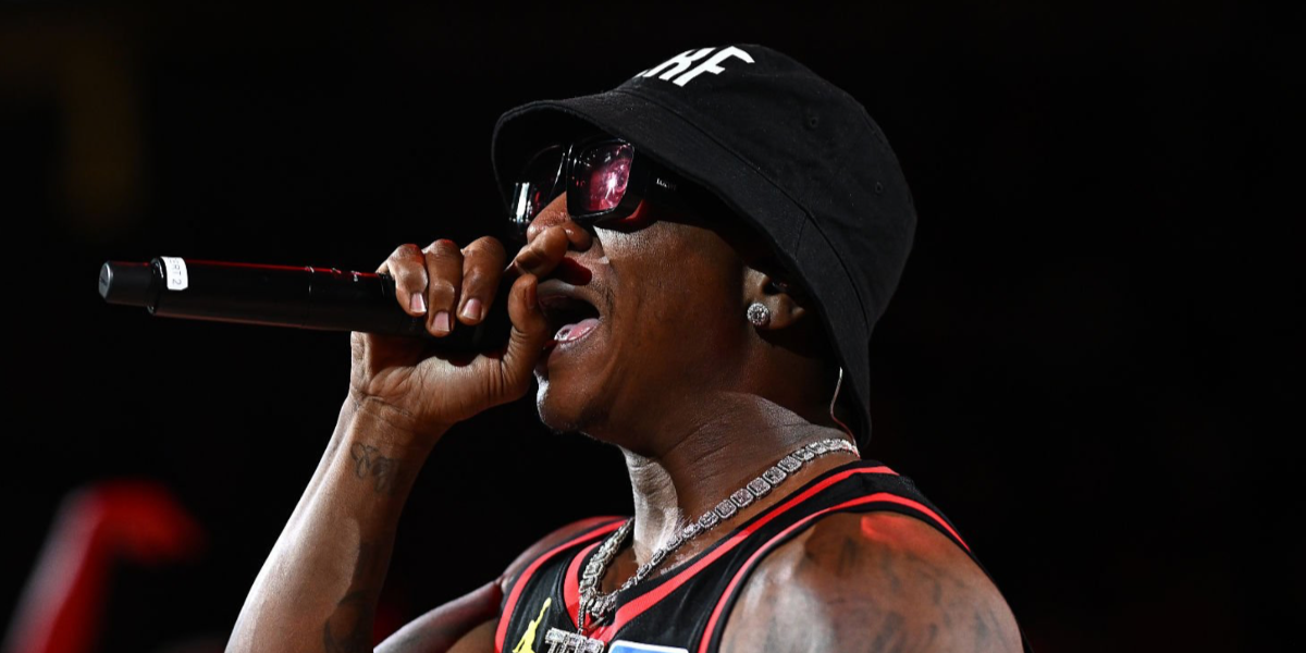 Rapper Yung Joc was seen wearing black Loewe x Paula's Ibiza LW40064U 01Y sunglasses with red lenses while performing during a timeout game between  between the New York Knicks and the Atlanta Hawks in April 2026.