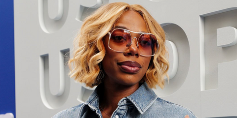 Actress Yvonne Orji was seen wearing silver Miu Miu MU A55S 1BC90Q oversized sunglasses with brown lenses on the Day Two of US Open 2026