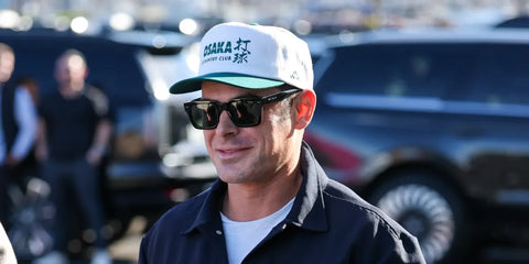 Zac Efron was seen wearing black Police Supernova 2 SPLQ88 700Y sunglasse with green lenses at the Super Bowl LX in San Francisco, February 2026.