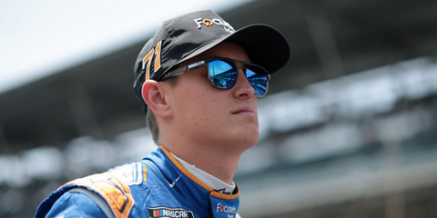 Zane Smith was seen wearing transparent grey Oakley Latch Beta OO9436 06 sunglasses with Prizm Polarised blue sapphire lenses during qualifying for the NASCAR Cup Series Brickyard 400 in Indianapolis, Indiana, July 2024